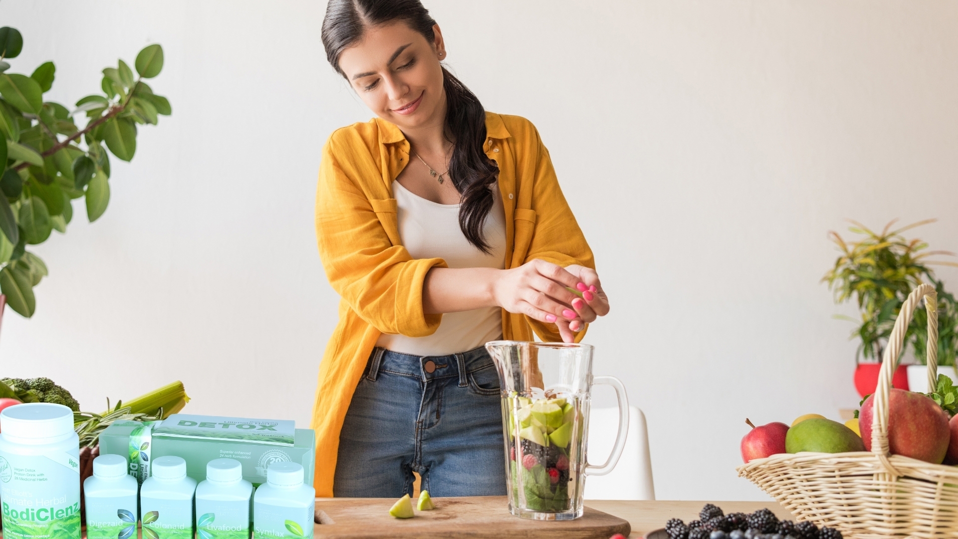 Woman Adding Vegetables in a Blender Woman Adding Vegetables in a Blender